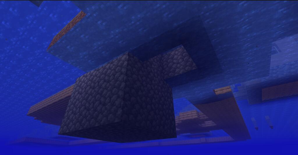 Скриншот из игры Minecraft с подводными блоками, образующими странную геометрическую конструкцию